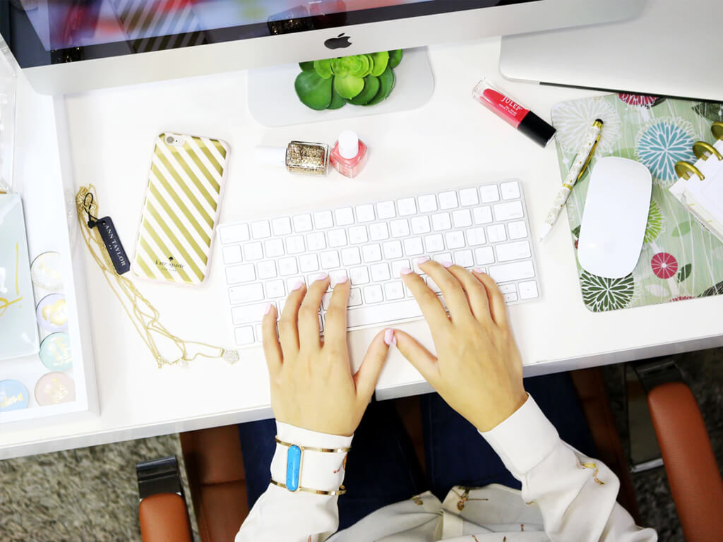 person typing on keyboard